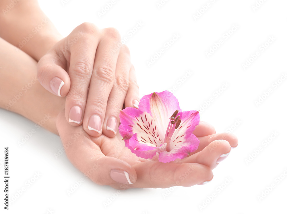 Young woman touching her hand and feeling moisturizing effect of cream on white background