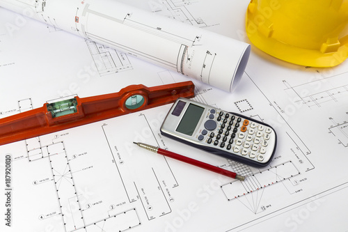 Building design: Office desk with project drawings