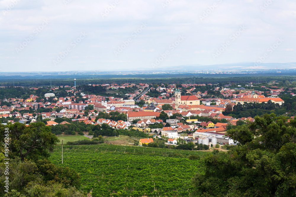 Fototapeta premium Church and castle in Valtice baroque town panorama, part of UNESCO World Heritage Site, Moravia, Czech Republic