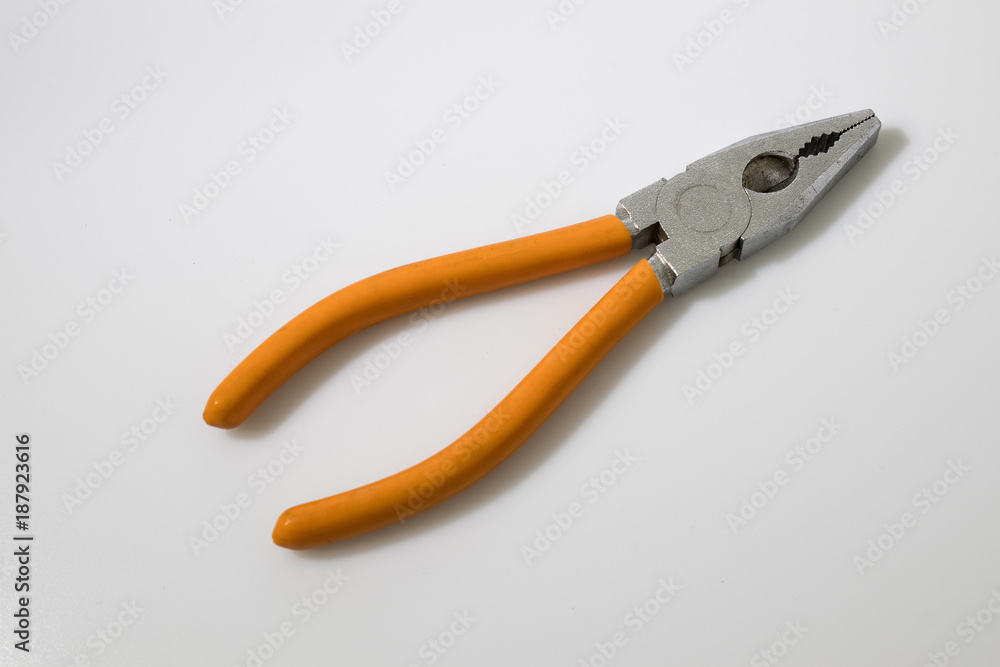 Orange flat-nose plier on a white background Orange flat-nose plier on a white background