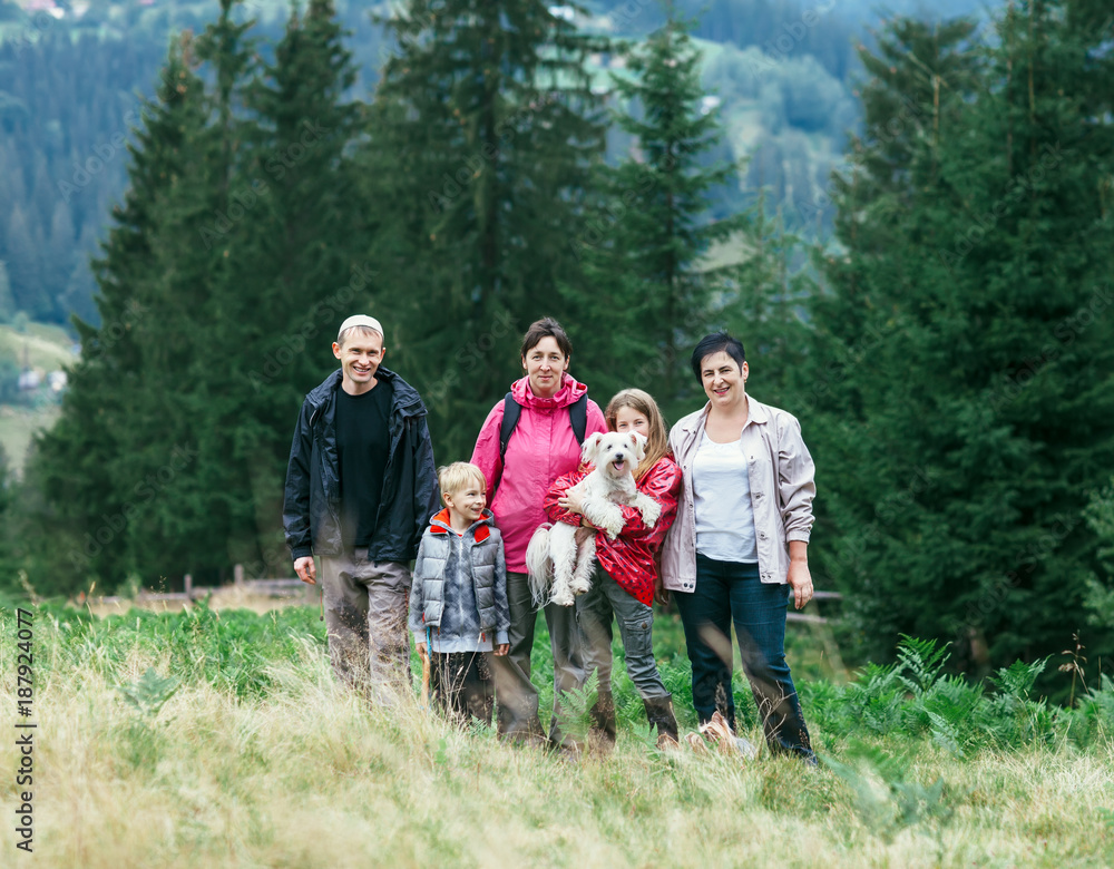 Portrait of happy family against tree background outdoors Portrait of happy family against tree background outdoors
