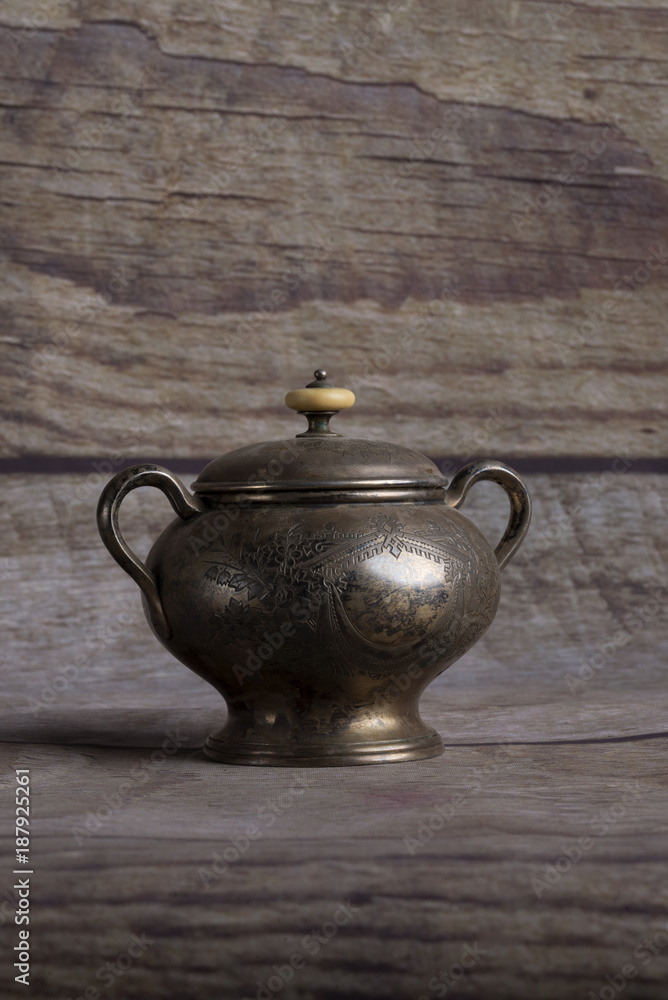 Very old silver kitchen accessories.Old silver kitchen utensils on black.
