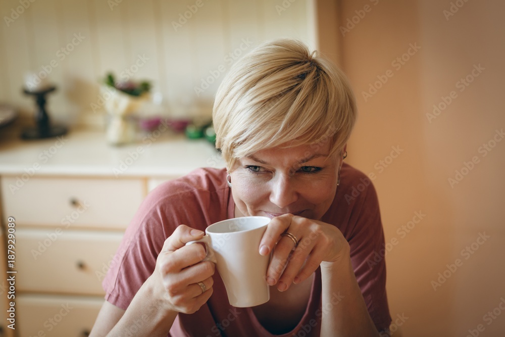 Smiling woman having coffee Smiling woman having coffee