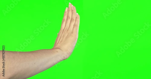 Female hand gestures on green screen: NO photo