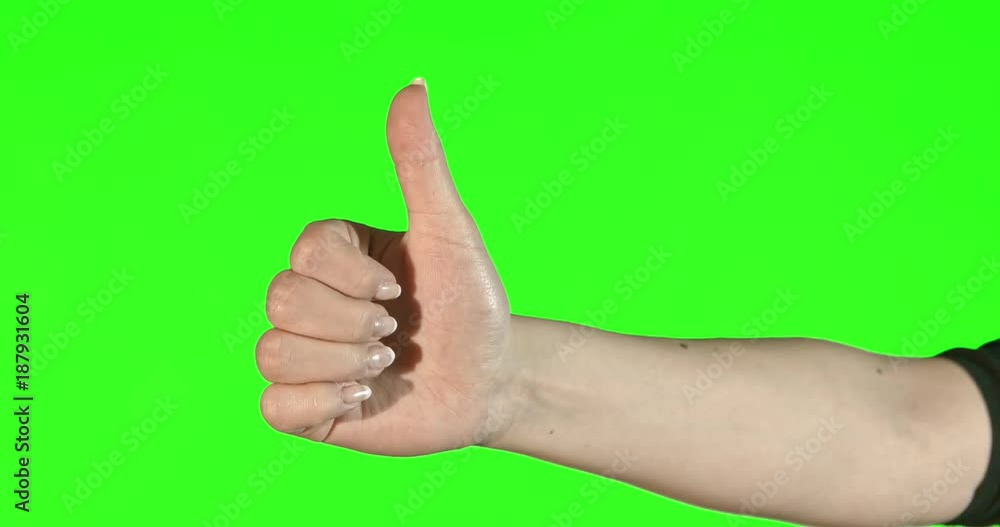 Female hand gestures on green screen: thumbs up Female hand gestures on green screen: thumbs up