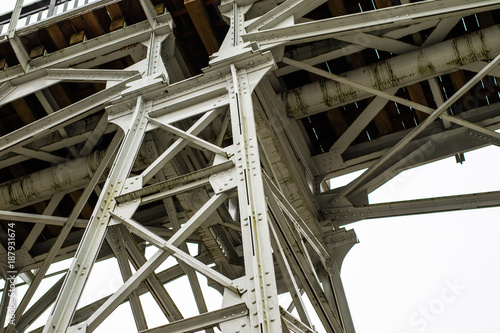 A bridge over a river built from a truss. Bridge, truss joined by rivets in old technology on the river.