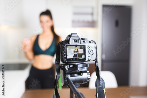 Young female vlogger recording content for her video blog. Fitness and healthy lifestyle concept.