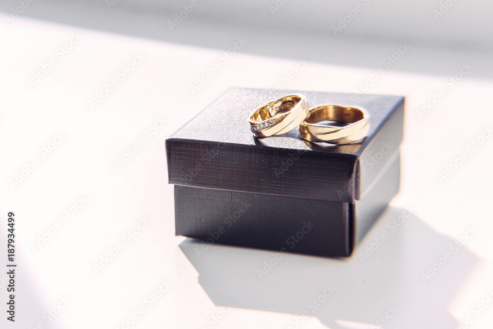 Gold wedding rings with inscription inside on the craft box. Gold wedding rings with inscription inside on the craft box.