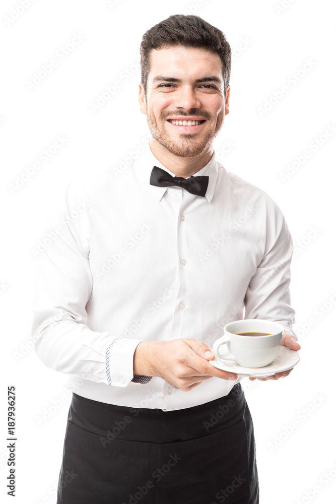 Handsome waiter bringing some coffee Handsome waiter bringing some coffee