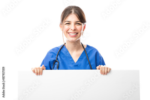 Cute health professional with a sign