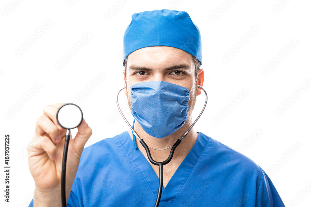 Attractive doctor using a stethoscope Attractive doctor using a stethoscope