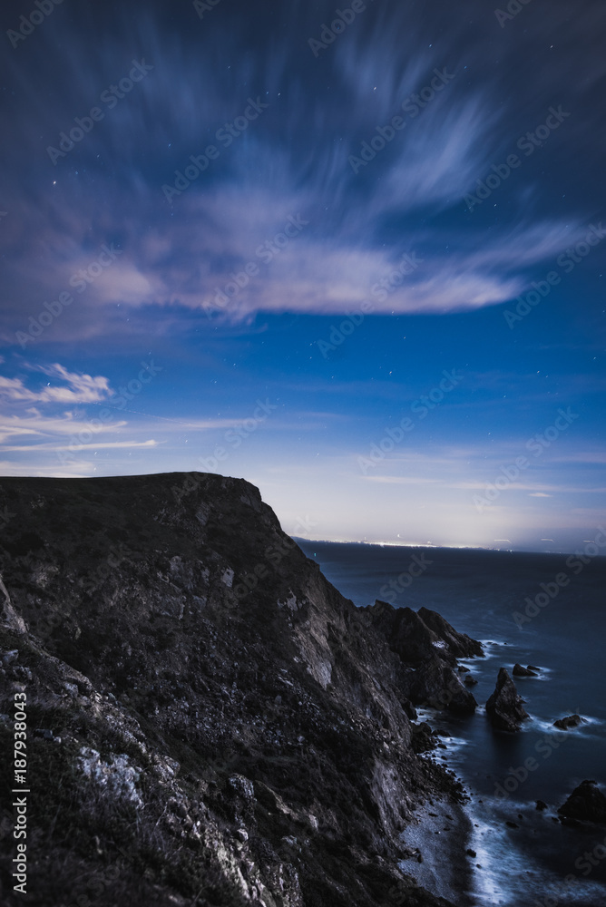 night shot of clouds in point reyes cliffside