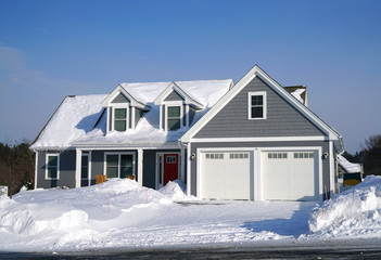 Winter house front view after snow storm