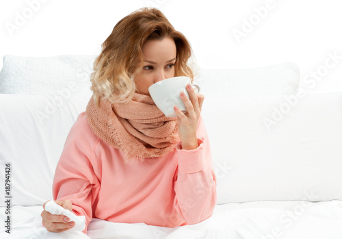 Woman having a cold  flu. Sore throat and coughing
