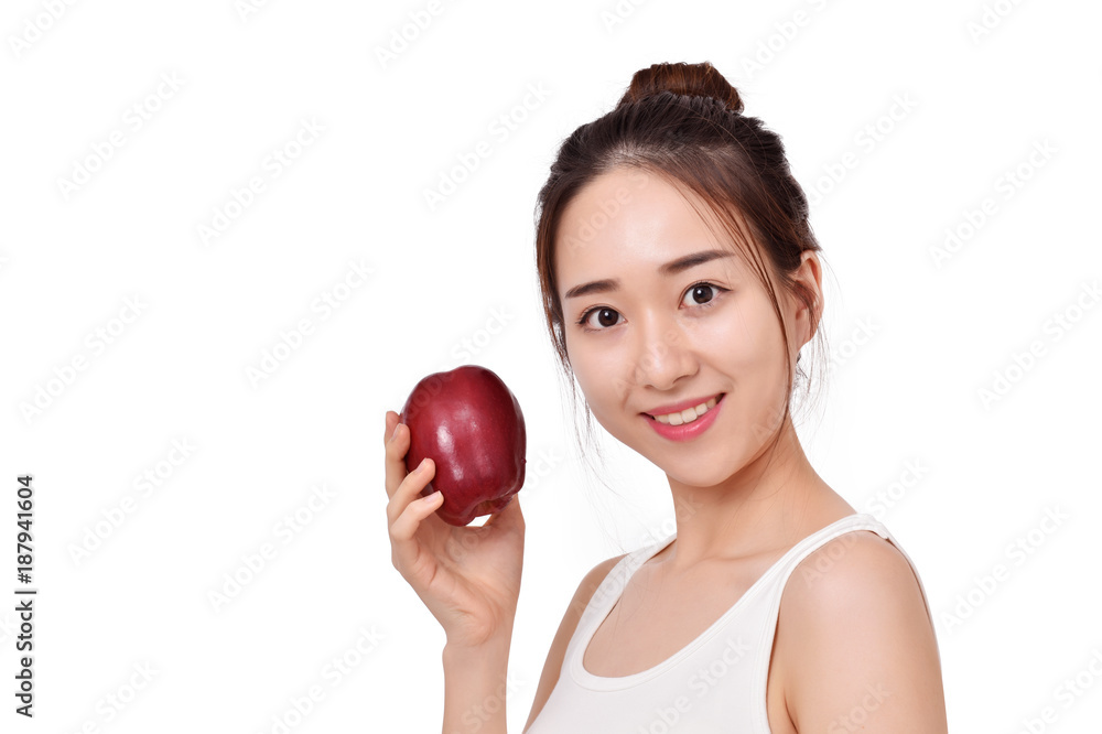 Happy healthy girl. Toothy smile portrait of a beautiful young woman, holding an apple, isolated on white. Happy healthy girl. Toothy smile portrait of a beautiful young woman, holding an apple, isolated on white.
