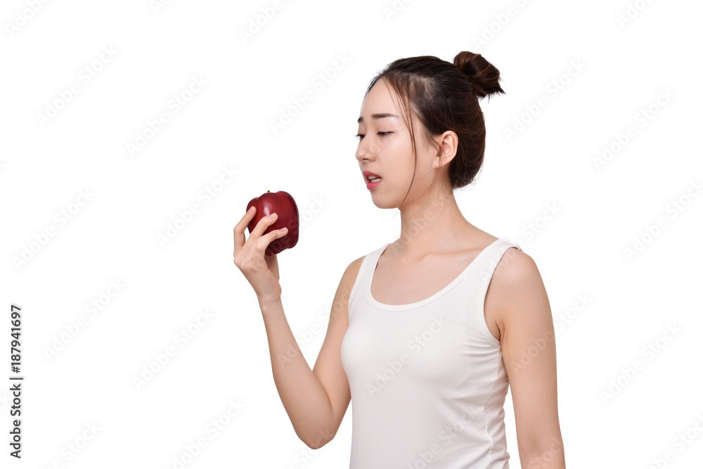 Woman with red apple feels tooth pain because of sensitive gums. Woman with red apple feels tooth pain because of sensitive gums.