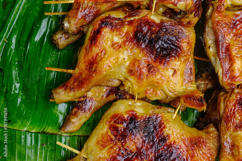 Grilled chicken on banana leaves photo