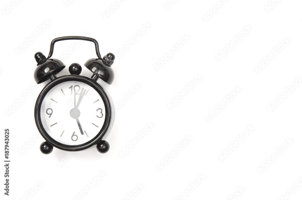 An Isolated Classic Black Alarm Clock An Isolated Classic Black Alarm Clock