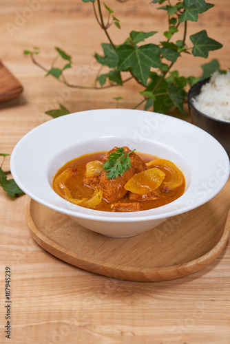 Chicken curry in a bowl / Vietnam chicken curry on wooden background