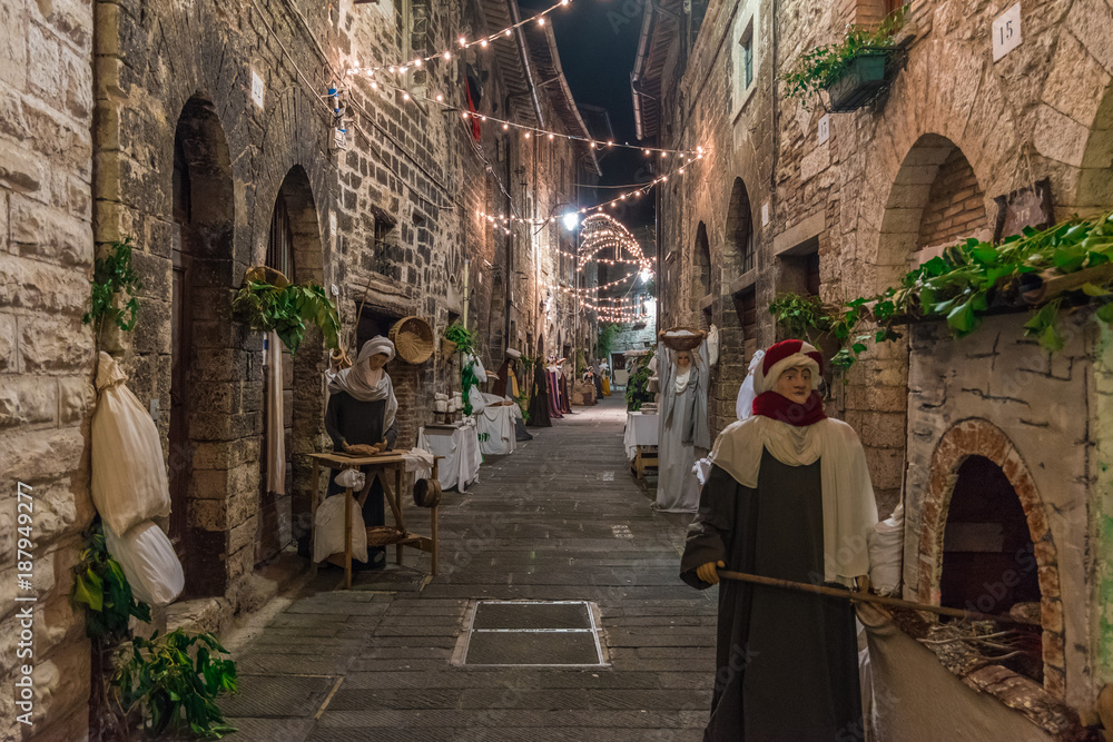 Gubbio, Italy - The awesome medieval town of Umbria Region, during the Christmas holidays, with the nativity scene of life-size statues in San Martino district
