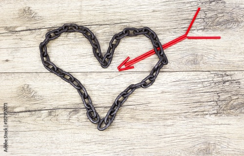 Chain heart shape with red wooden arrow