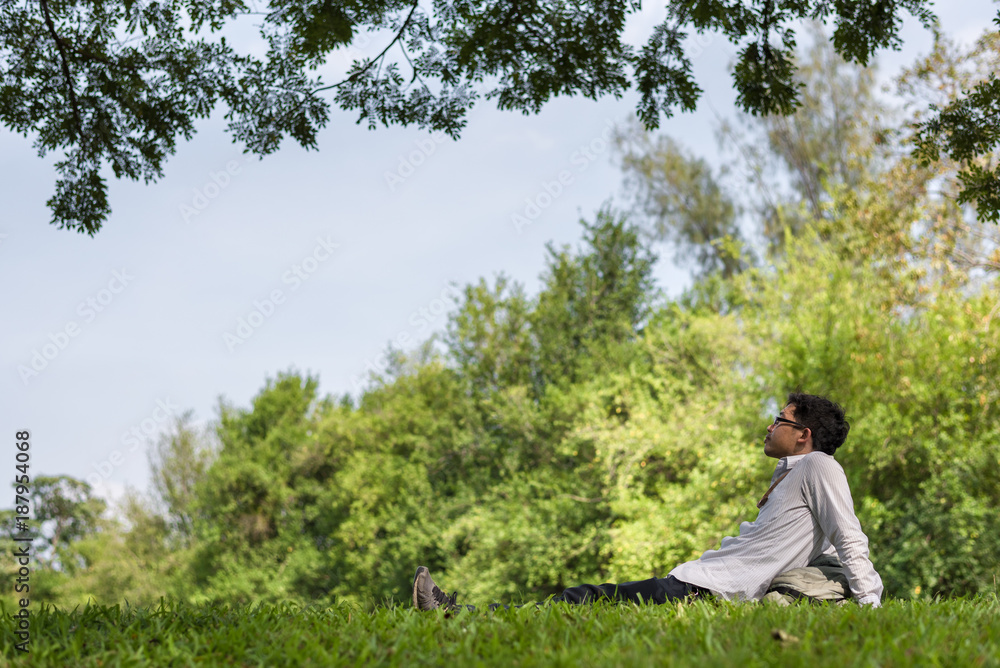 man relaxing in nature park.