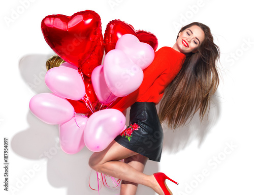 Valentine's Day. Beauty girl with colorful air balloons having fun, isolated on white background