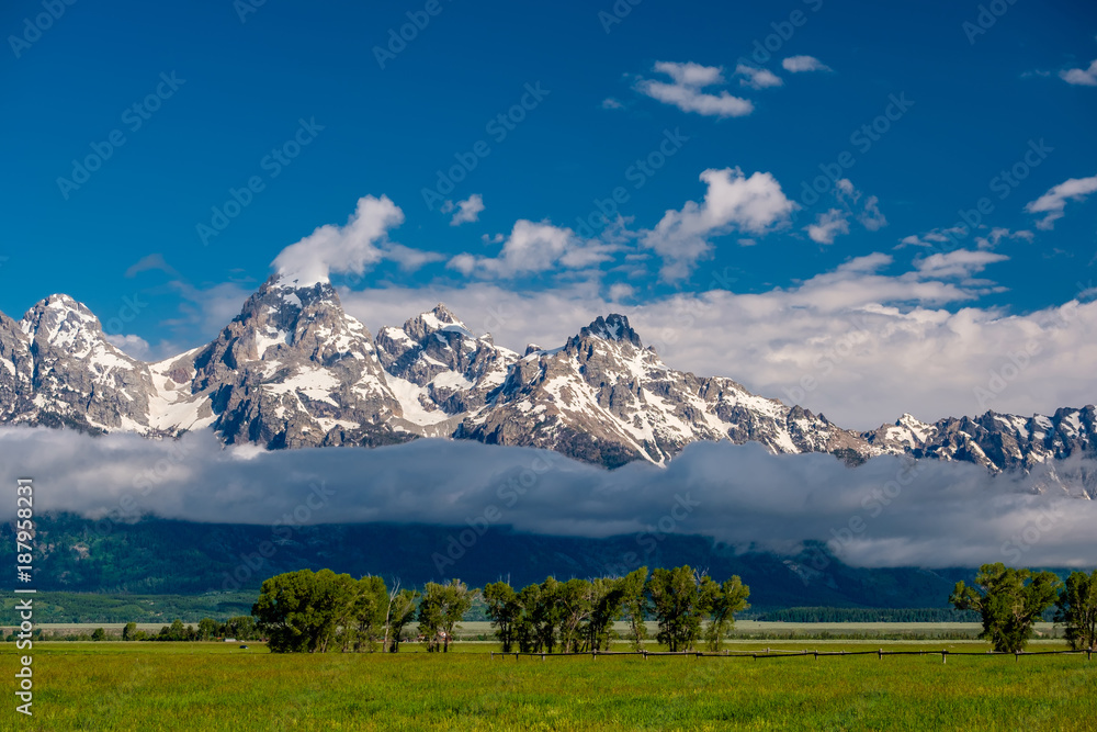 Grand Teton Mountains with low clouds