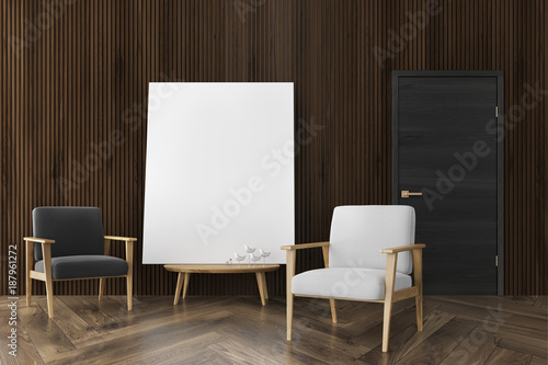 Fototapeta Naklejka Na Ścianę i Meble -  Dark wood living room, two armchairs, poster