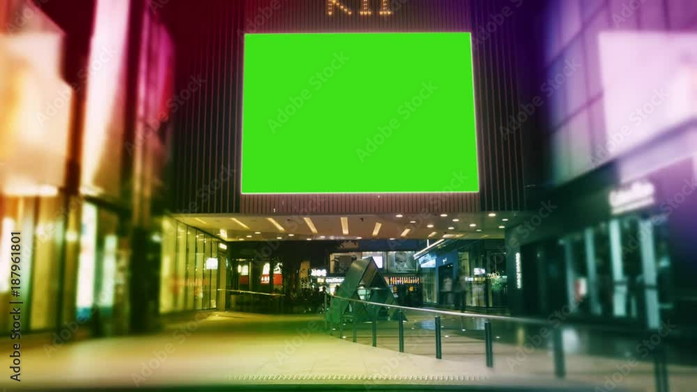 Time Lapse.A Billboard with a Green Screen on a Evening Streets of Hong Kong . Time Lapse.A Billboard with a Green Screen on a Evening Streets of Hong Kong .