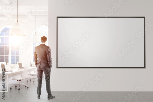 Businessman looking at a whiteboard in office