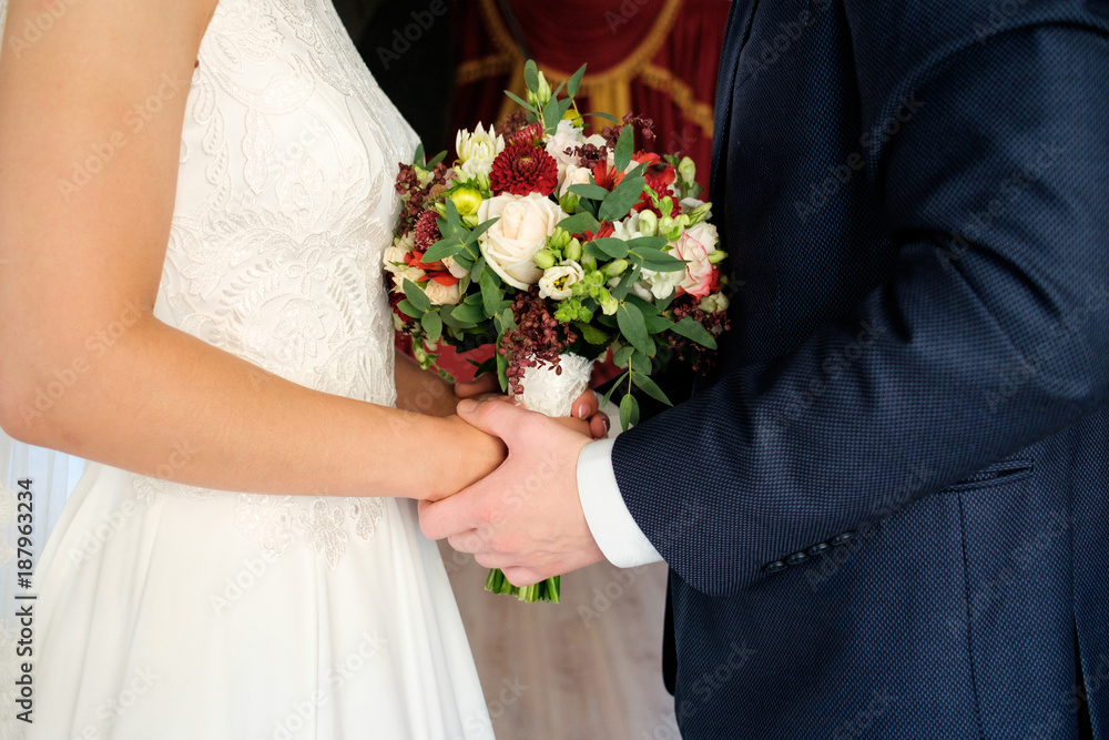 bride and groom play handies and keep bouquet on hands bride and groom play handies and keep bouquet on hands