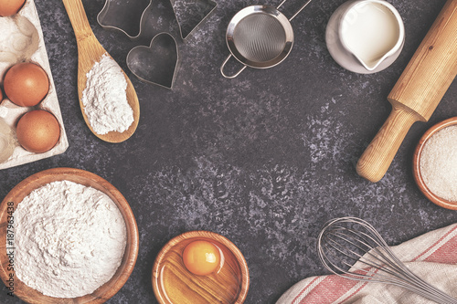 Ingredients for baking  - flour, wooden spoon, rolling pin, eggs