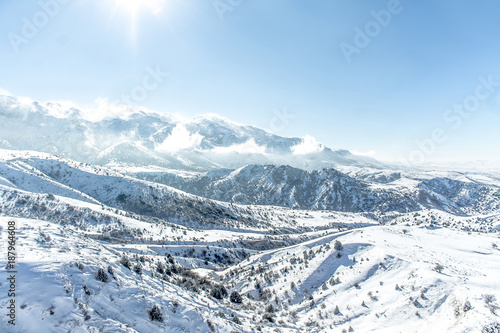 Fototapeta Naklejka Na Ścianę i Meble -  Beautiful Snow-covered mountains in winter in sunny weather