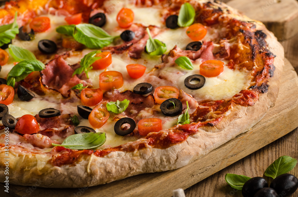 Rustic pizza with tomato, cheese, salami Rustic pizza with tomato, cheese, salami