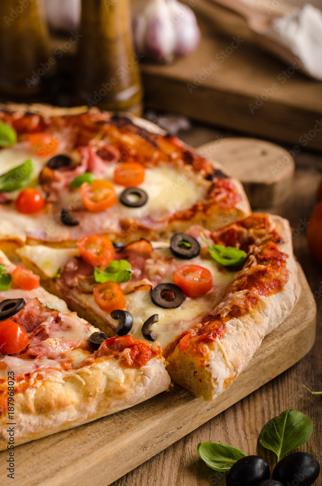 Rustic pizza with tomato, cheese, salami