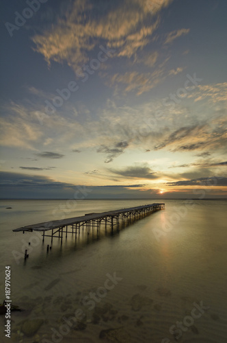 Concrete broken bridge in the sea against a vibrant sunrise in Varna  Bulgaria