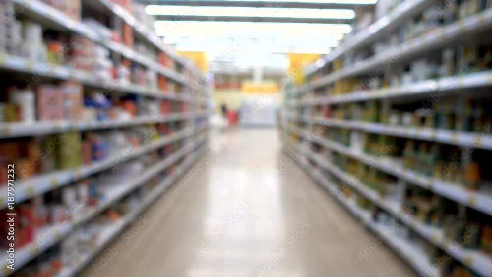 shop, blurred background, people with shopping carts. People are shopping in a supermarket, defocused blurred background shop, blurred background, people with shopping carts. People are shopping in a supermarket, defocused blurred background