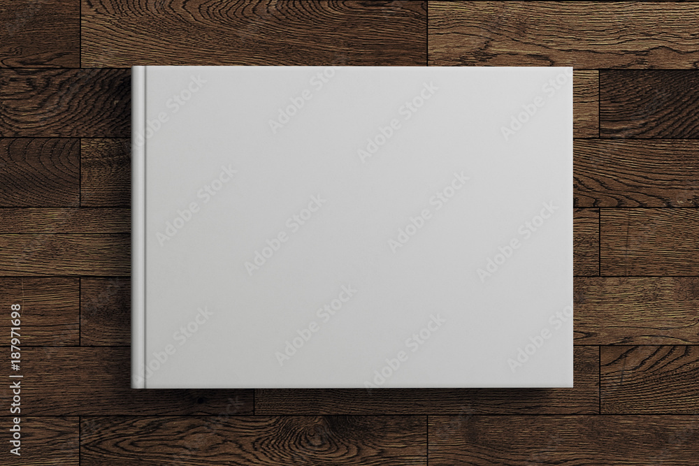 Obraz premium Blank white book on wooden background