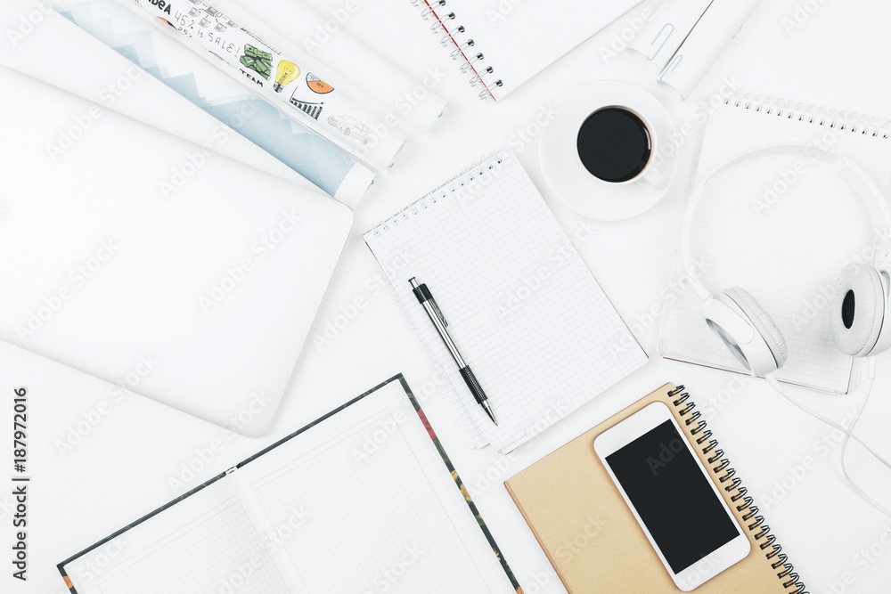 Modern white workspace with empty smartphone Modern white workspace with empty smartphone
