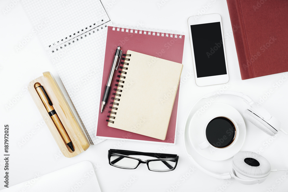 Creative white workspace with empty smartphone Creative white workspace with empty smartphone