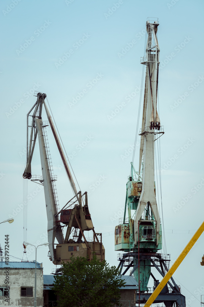 Iron cranes for lifting cargo into ships