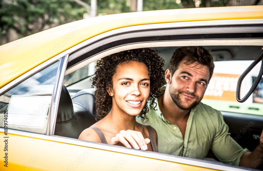 Happy couple on a yellow cab in New york Happy couple on a yellow cab in New york