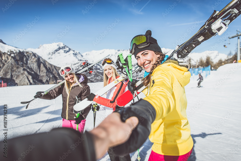 Group of friends going to ski on the alps Group of friends going to ski on the alps