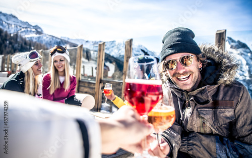 Fényképezés Group of friends having fun in a ski resort