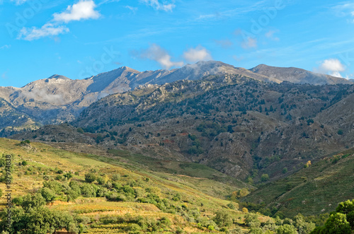 Mountains and meadows under blue sky on the island Grete, Greece