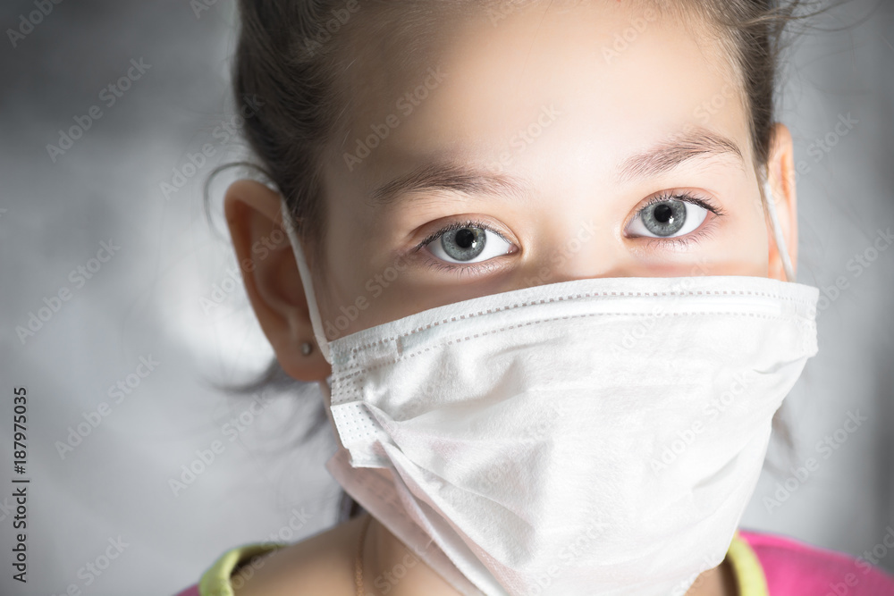 Beautiful child in the mask from diseases and viruses Beautiful child in the mask from diseases and viruses