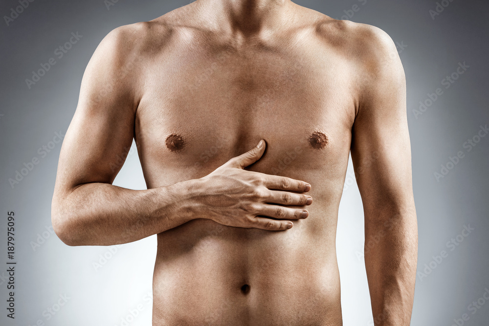 Digestion issue. Man holding his hand in area stomach. Medical concept. Digestion issue. Man holding his hand in area stomach. Medical concept.