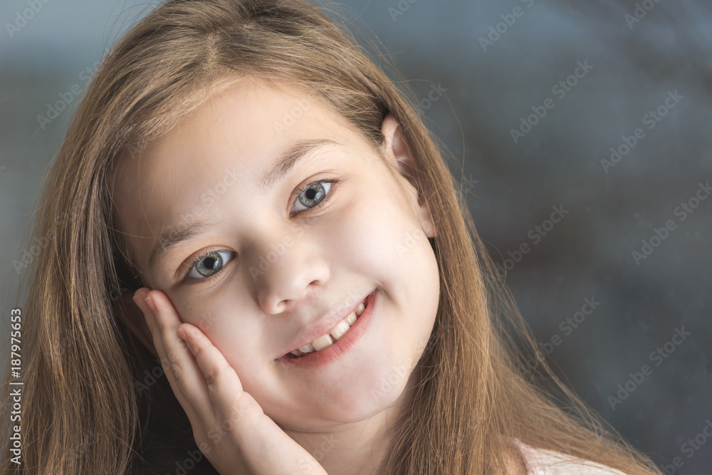 Palm on the cheek of a happy child Palm on the cheek of a happy child