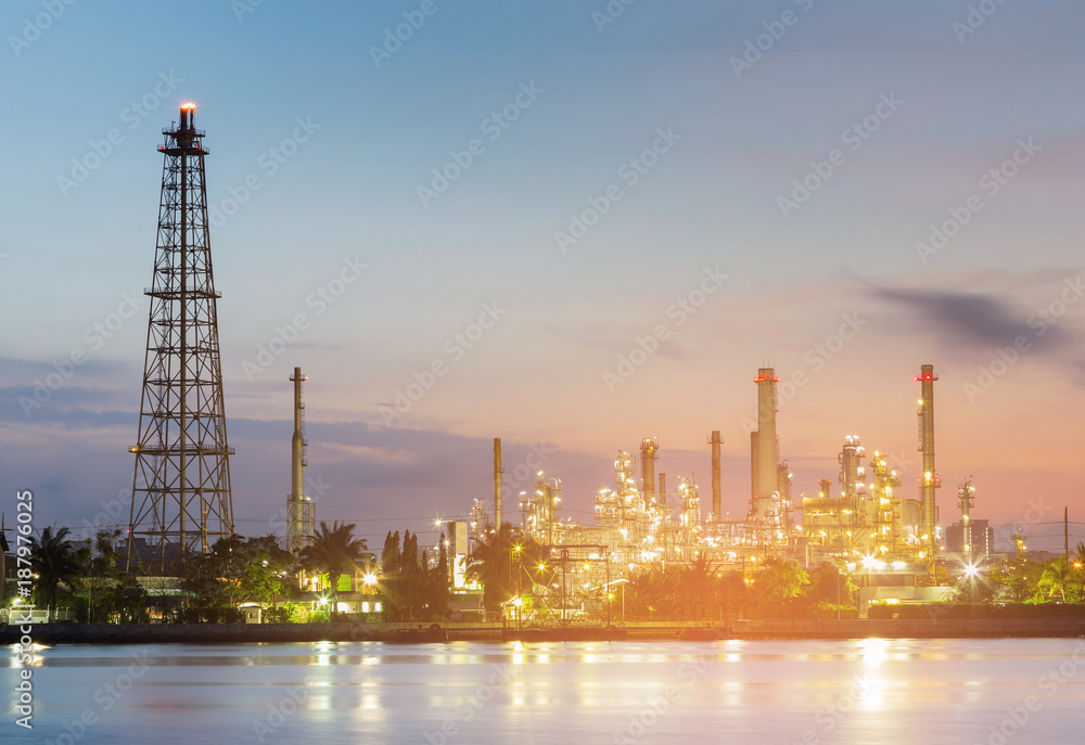 Refinery river front night view with after sunset sky background